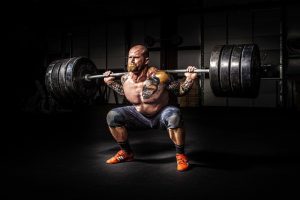man lifting weights